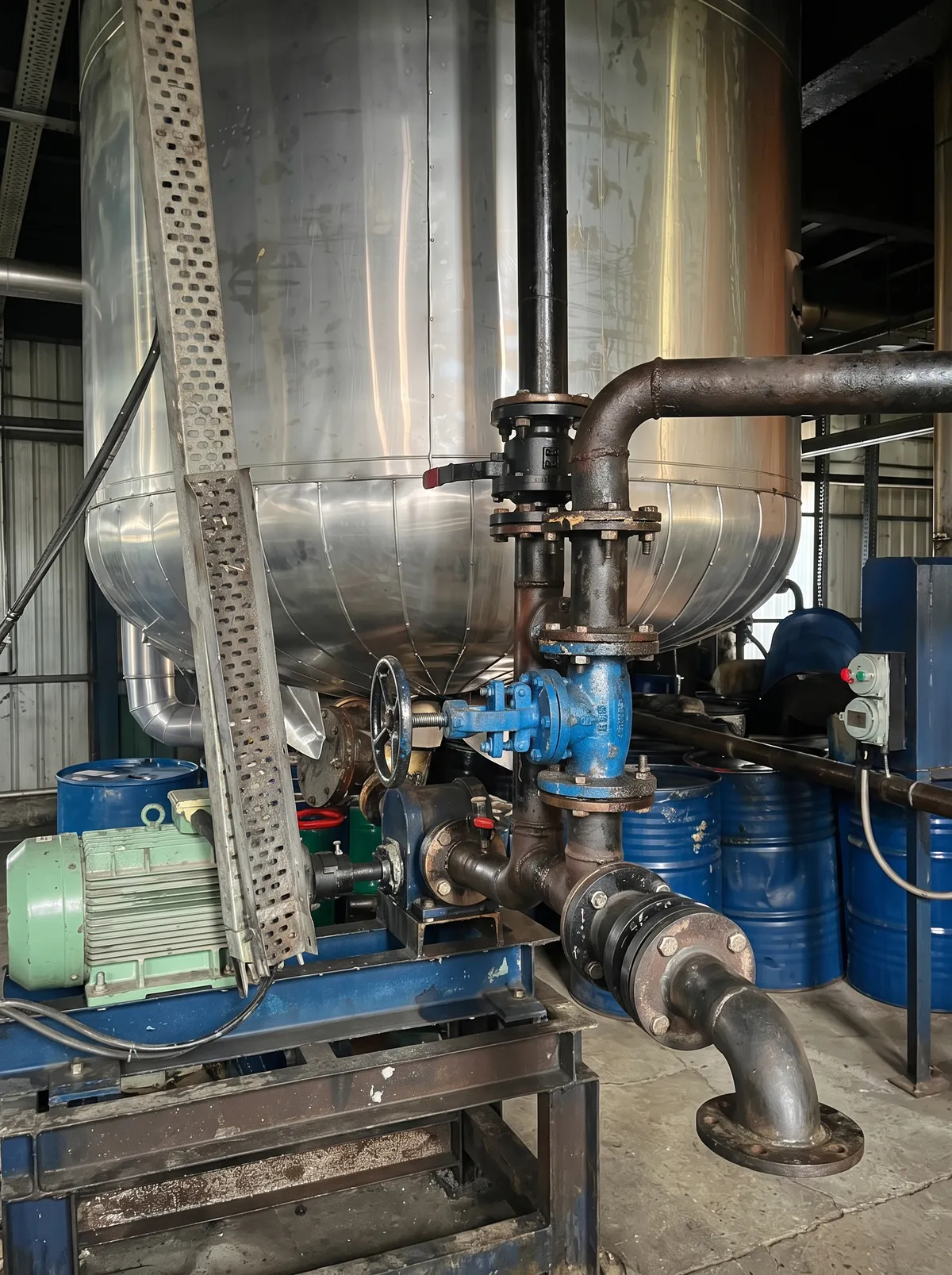 Stainless steel process vessel with valves and pump in the grease plant
